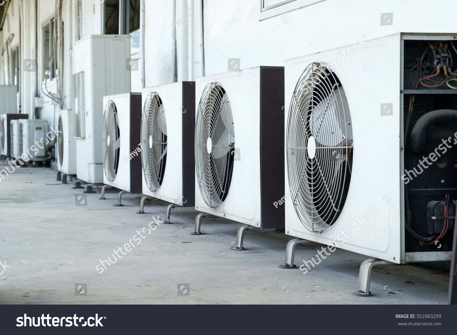 stock-photo-air-conditioner-compressor-installed-in-old-building-352983299