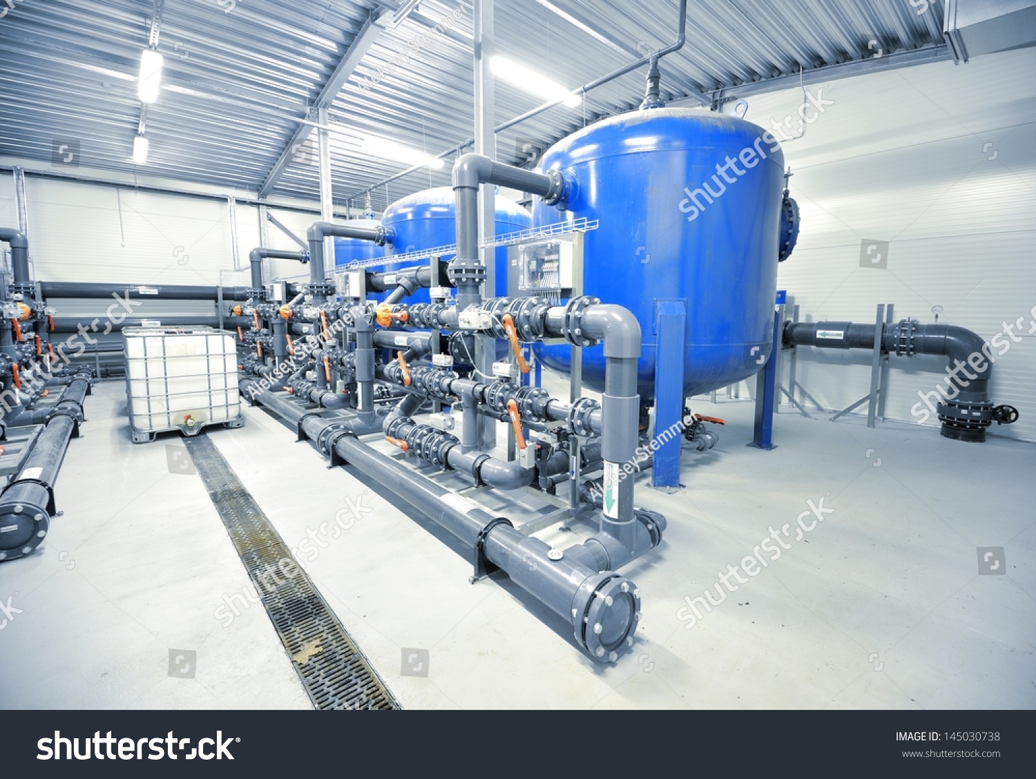stock-photo-new-plastic-pipes-and-colorful-equipment-in-industrial-boiler-room-145030738